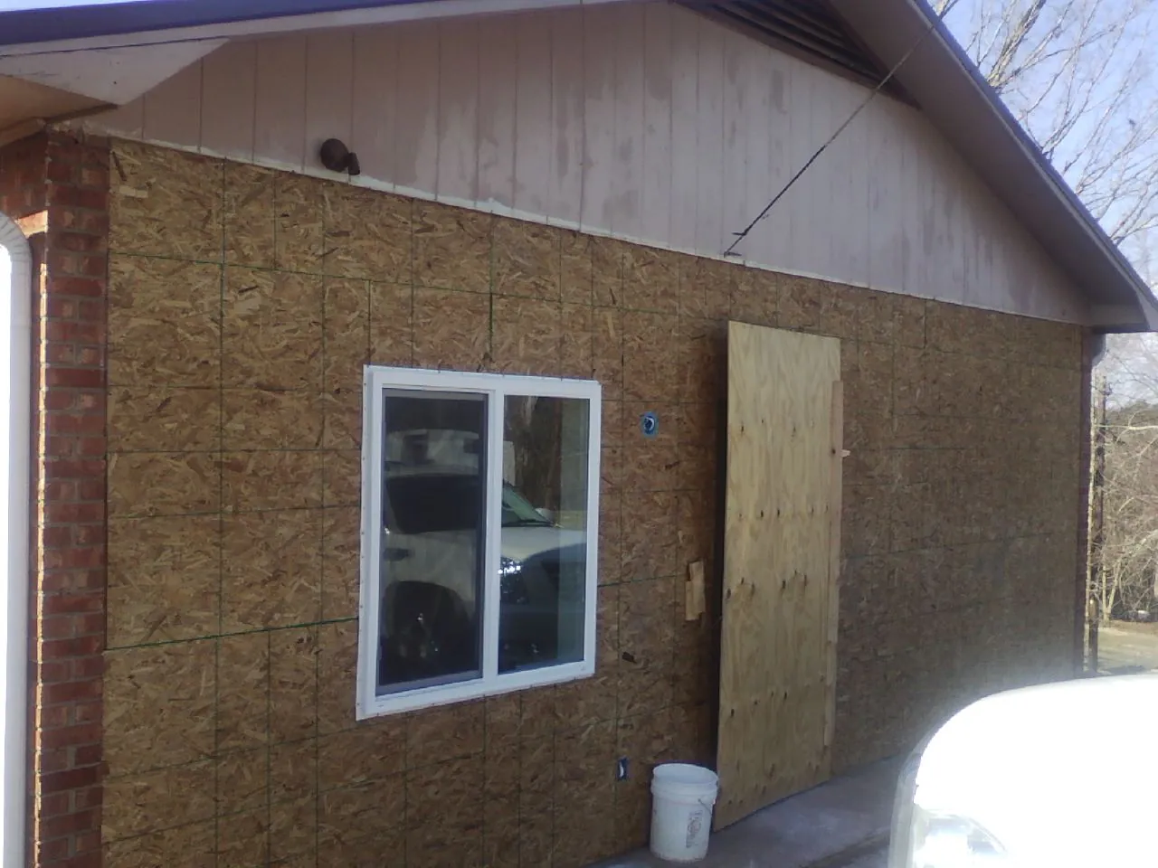 OSB sheathing on a garage addition wall before siding in Takoma Park